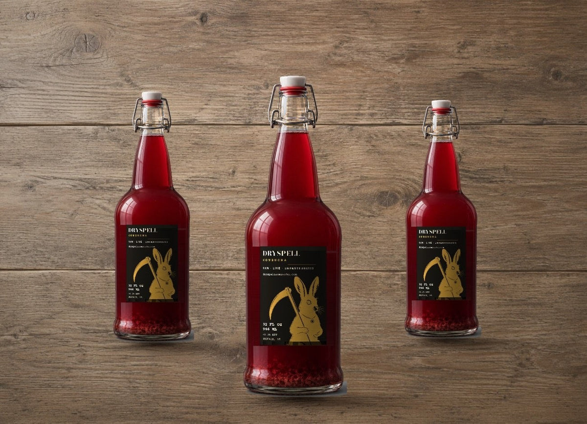 Three Dryspell bottles on wood